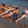 Andre, far right, warms up with the Dos Pueblos boys water polo team