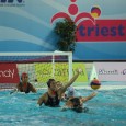 KIley Neushul defends against a Hungary shooter in front of goalie Sami Hill during quarterfinal action at the FINA Women's Junior World Championships. (Photo by Peter Neushul)
