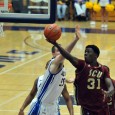 Santa Clara's Niyi Harrison escaped Somogyi's reach on this drive to the basket.