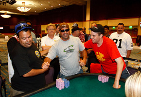 Ricky Rodriguez, left, shakes the hand of Rob Abraham, middle, with Mike Noori, right, after the conclusion of the Central Coast Poker Championship