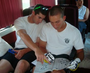 Vinnie St. John helps Beau Maggi with a crossword puzzle