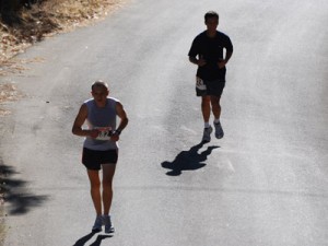 Two runners keep pace before making the final turn up to the finish