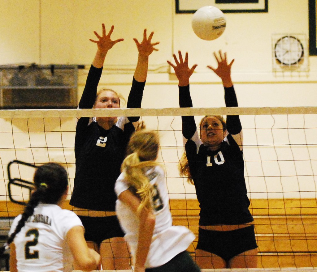 Dos Pueblos' Carly Wopat (2) and Sally Yingst go up for a block.