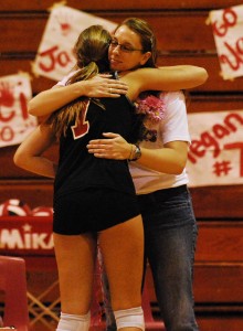 Carpinteria head coach Katie Dolge gives senior Megan McMahon a hug prior to Thursday's match