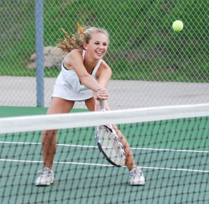 Santa Barbara's Emily Baum gets a laugh while hitting a volley