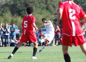 Westmont's Hugo Pizano takes a shot through defenders