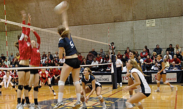 Laguna Blanca's Jackie Harvey goes up for a spike as her teammates look on (photo courtesy of Michael Ditmore).