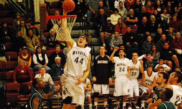 Westmont's John Miller took a pass from Blake Bender for the fast-break dunk on Saturday night at Murchison Gym