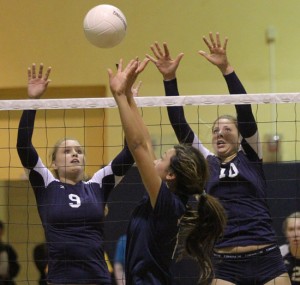 Dos Pueblos' Kelcey Chaffin (9) and Sally Yingst go up to block as Sailors sophomore Cinnamon Sary dishes out a set.