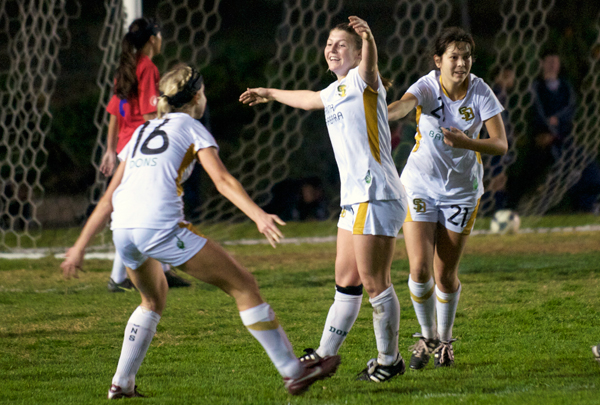 Santa Barbara's Megan Flynn, center, celebrates the game-winning goal with teammates Natalie Cvetanic, left, and Hannah Brisby, right.