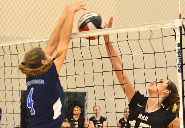 Phoebe Madsen with a stuff block while playing for the 15-Blue Team