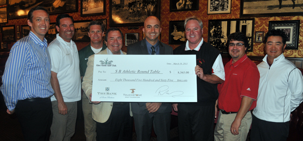 Rich Nihaus presents a check to the local high school golf programs on Monday. (Presidio Sports Photo)
