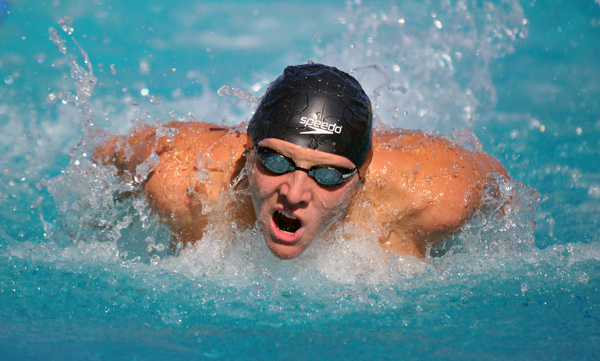 Alex Valente swims the 100 butterfly on Thursday. (Presidio Sports Photo)