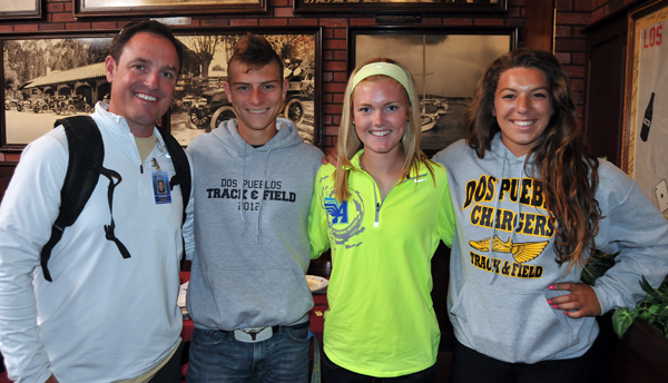 Dos Pueblos track & field coach Chris Mollkoy, left, with runners Max Davis, Addi Zerrenner, and thrower Stamatia Scarvelis.