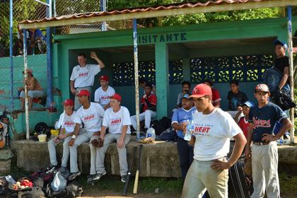 Santa Ynez Heat players in the "visitantes" dugout.