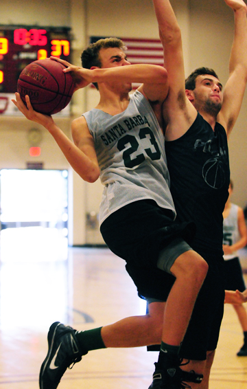 Santa Barbara High's Jack Baker, pictured driving to the basket during a summer league game, is a returning First Team All-Channel League player for the Dons. (Presidio Sports Photo)