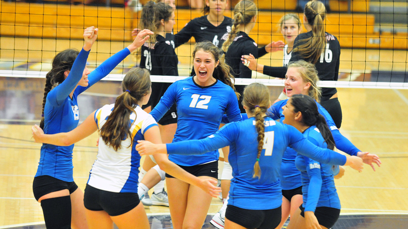 The Gauchos celebrate a point won during the third set on Friday.