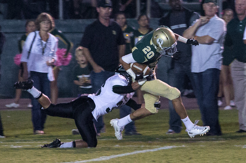 Santa Barbara High's Jordan Guzman  gets brought down by a Pacifica' defender. (Wade the Giant photo)