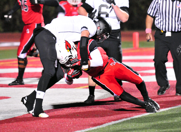 Abel Gonzalez of Bishop Diego fights his way into the end zone for the Cardinals' first touchdown of the game. (John Dvorak photo)