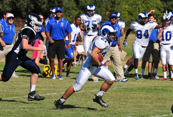 Cate's John Basar races out of reach for an interception return to the endzone.
