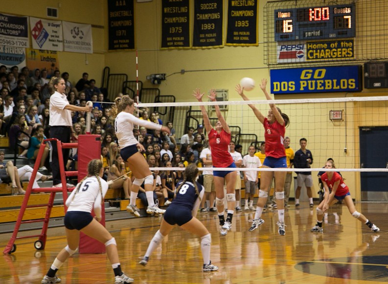 Dos Pueblos outside hitter Natalie Klapp hits through the San Marcos block. (Photo Wade the Giant)
