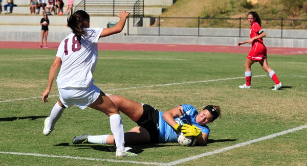 Westmont's Sophie Fuller applies pressure to Arizona keeper Sydney Roller-Sotak, who made seven saves in the second half.