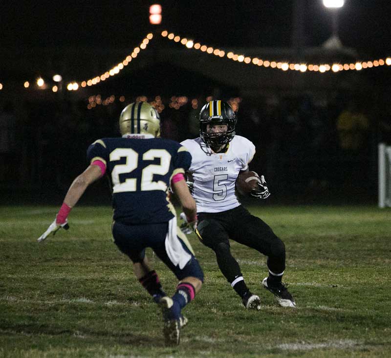 Ventura's Chase Gardner gets stopped in his tracks by Dos Pueblos safety Tyler Welch.  (Wade Carr)