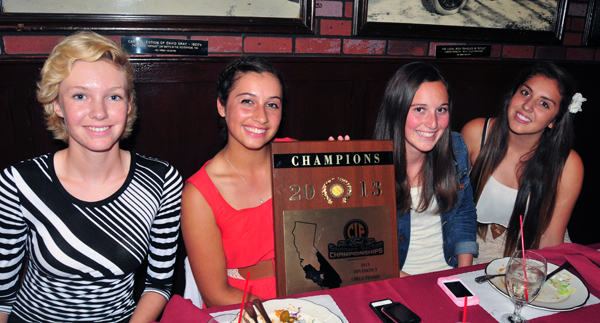 Members of the Carpinteria girls tennis team show off the CIF championship plaque.