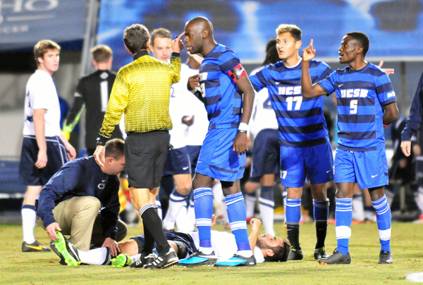 UCSB captain Goffin Boyoko, Reed McKenna and Fifi Biden plead their case after Biden was given a red card early in Sunday's match. Penn State's Mason Klerks is on the ground being attended to by the Penn State trainer. (Presidio Sports Photo)