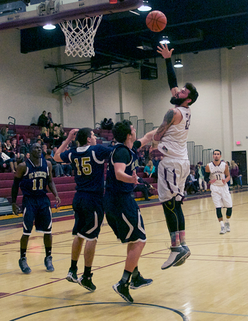Westmont's Daniel Carlin throws up a uncontested hook shot in the lane on Saturday.