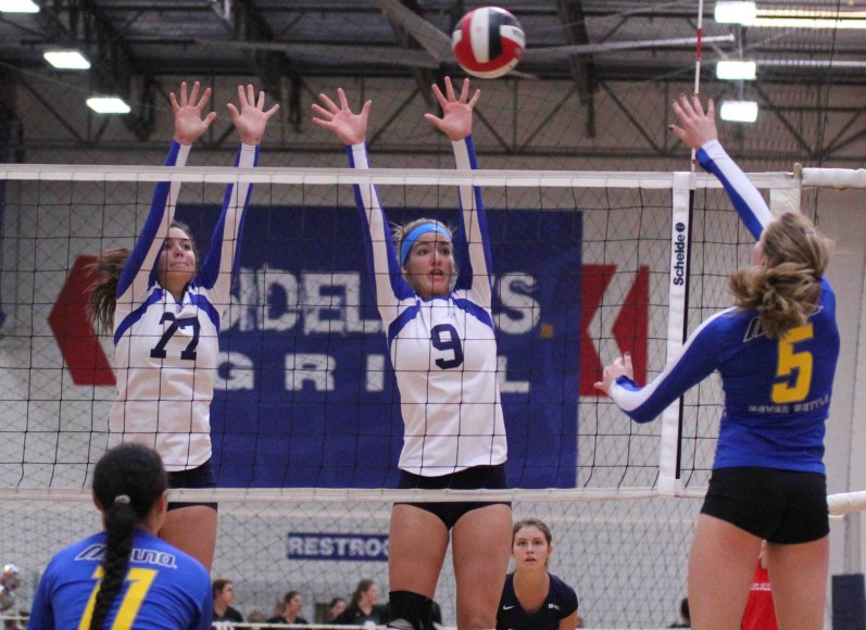 Emma Harrah, left, and Natalie Klapp put up a block for the Santa Barbara Volleyball Clubs 18-Blue team.
