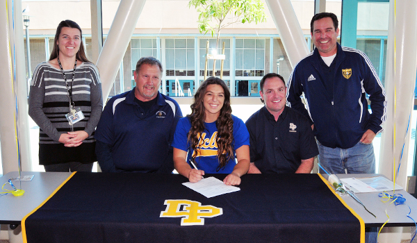 UCLA-bound Stamatia Scarvelis is joined by her parents, left, DP track coach Chris Mulkey and athletic director Dan Feldhaus.