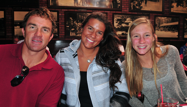 San Marcos and SBCC swimming coach Chuckie Roth with athletes Alyson Marrs, center, and Olivia Smith, right.