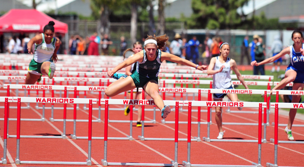 Santa Barbara High's Natasha Feshbach clears the final hurdle well ahead of the rest of the heat.