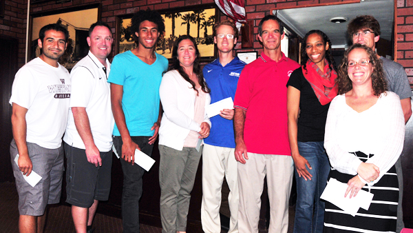 Local prep and college track coaches received checks from the Santa Barbara Athletic Association for their work on the Santa Barbara International Marathon.