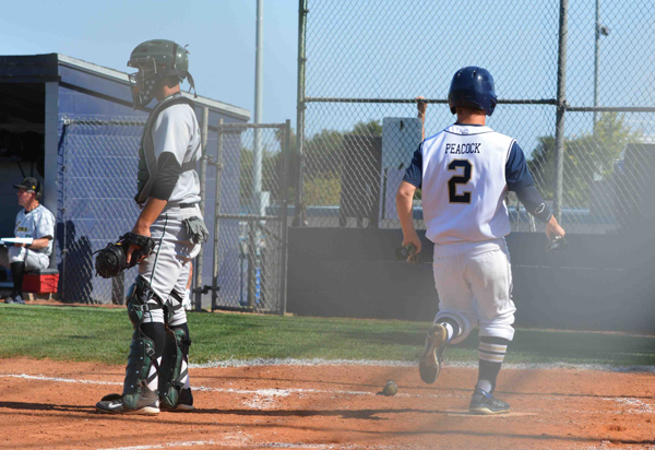 Quinn Peacock scores the winning run for Dos Pueblos on hit by Daniel Buratto. 