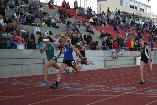 Jill Fisher of San Marcos edges Santa Barbara's  Natasha Feshbach in the girls 100 at the Channel League Championships. (Photo by Scott Gibson)