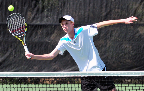 Cate senior Michael Revord takes a volley at the net during a doubles set in Wednesday's CIF match.