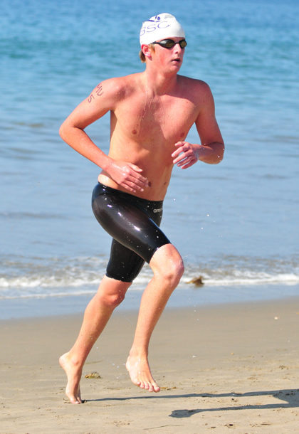 Ben Brewer of the Santa Barbara Swim Club won the 1-mile ocean swim in 18:56.