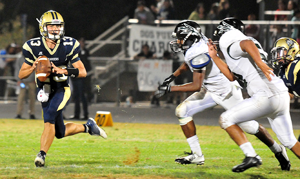 Burnes moves to avoid Pacifica's pass rush, which produced eight sacks.