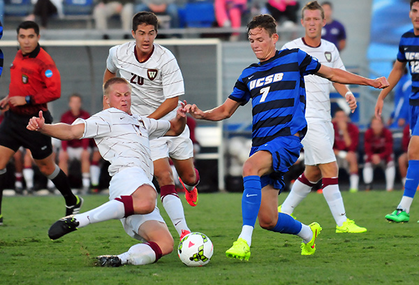 Westmont's Tanner Wolf, left, and UCSB's Drew Murphy challenge for a ball in the midfield.