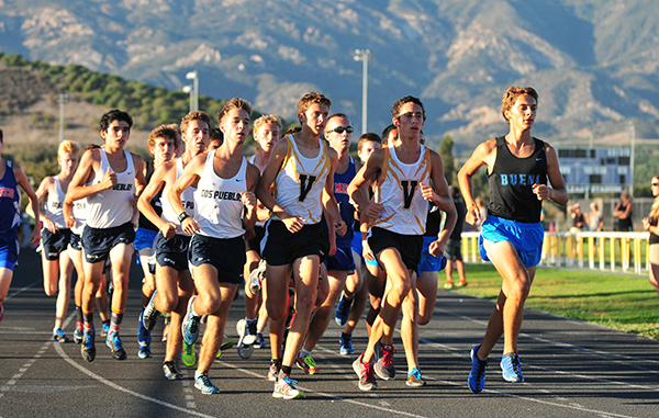 Kaleb Kunes, right, won the first Channel League cross country race of the season on Wednesday.