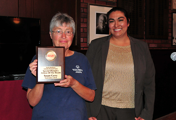 Susan Carey, left,  is introduced as the Special Olympics Athlete of the Month by Andrea Diaz.