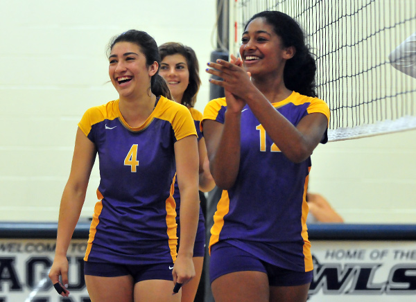 Karla Chavez, left, and Emily Beasley, right, gesture to their fans during the match.
