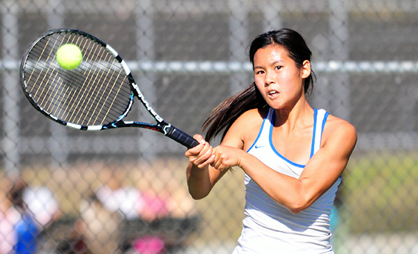 Cate's Julia Gan hits a two-handed forehand in Saturday's match. (Presidio Sports Photos)