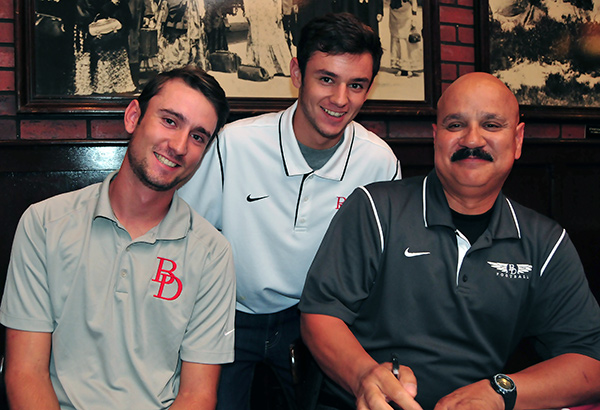 Longtime Bishop Diego assistant football coach Ralph Molina (right) was joined by his sons Gabe (left) and, Daniel at Monday's Santa Barbara Athletic Round Table press luncheon.