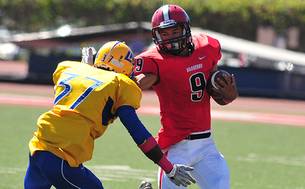 Cedric Cooper of SBCC stiff-arms a L.A. Southwest defender. Cooper rushed for 53 yards on 12 carries.
