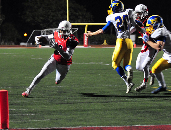 Bishop Diego's Abel Gonzalez breaks around the edge with the end zone in sight.
