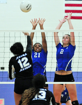 Cate's Xandrine Griffin and Delaney Mayfield get up in front of Azusa's Brianna Gomez.