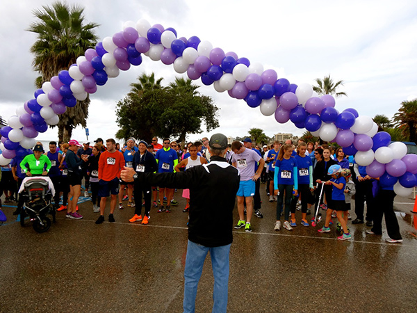 Competitors gather for the start of the Domestic Violence Solutions 5k Run for Love on Saturday at Goleta Beach Park. (Randy Weiss Photos)